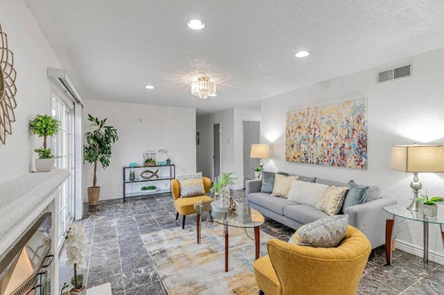 living room with a textured ceiling