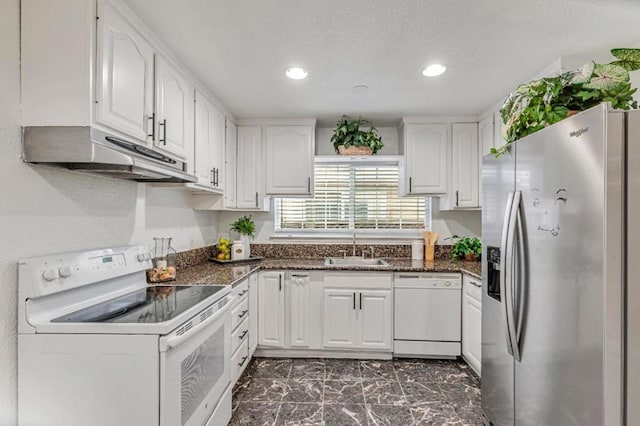 kitchen featuring white cabinetry, sink, and white appliances