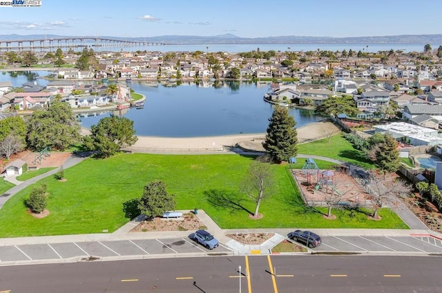 drone / aerial view featuring a water and mountain view