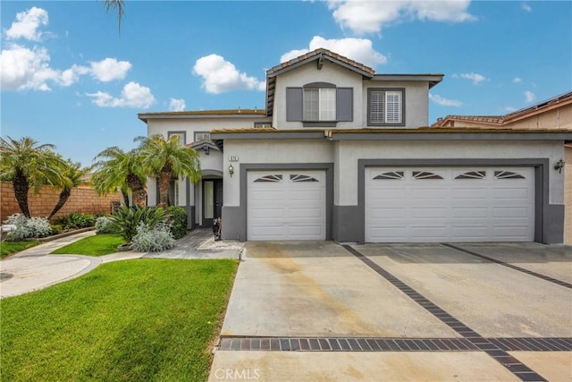 view of front facade with a garage and a front lawn