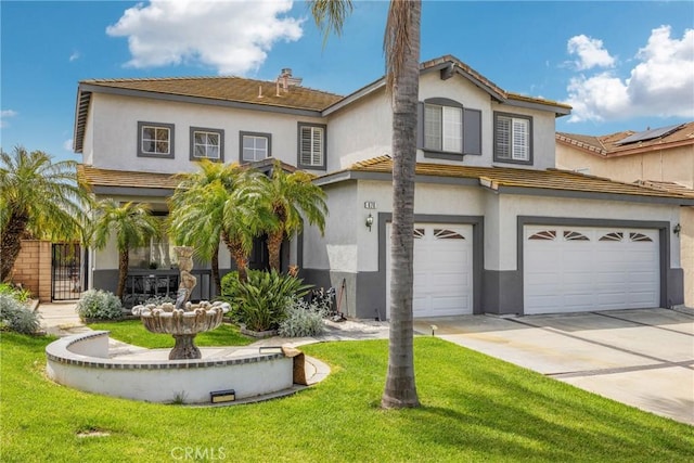 view of front of property with a garage and a front yard