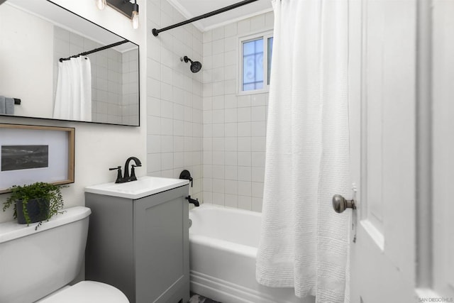 full bathroom featuring shower / tub combo with curtain, vanity, and toilet