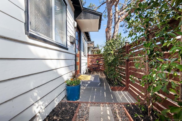 view of side of property with a patio