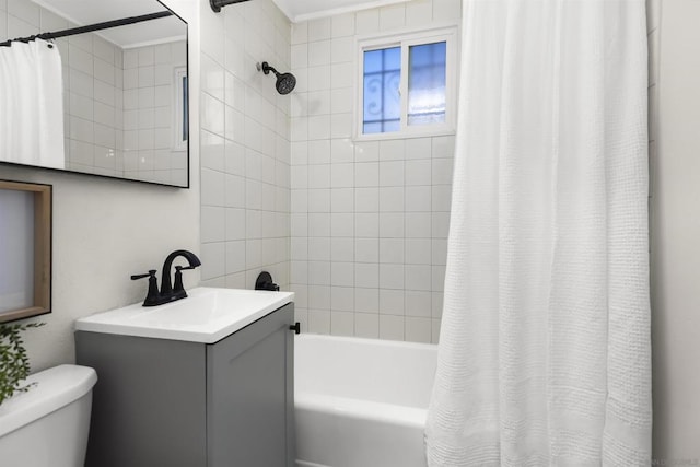 full bathroom with shower / tub combo with curtain, vanity, and toilet