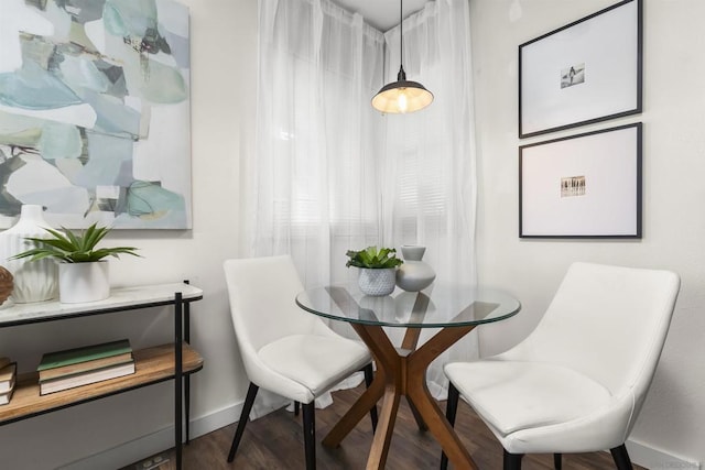 dining area with dark wood-type flooring