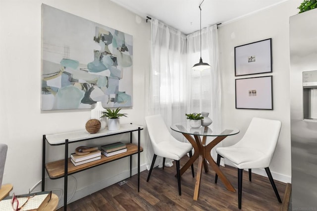 dining room with dark hardwood / wood-style floors