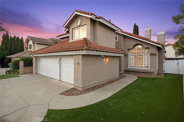 exterior space with a garage and a yard