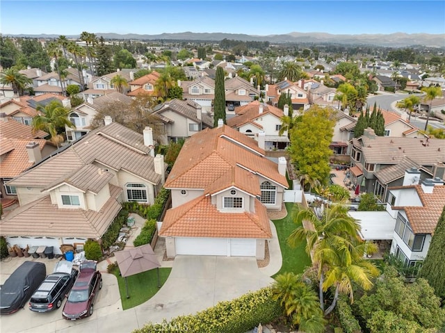 birds eye view of property with a mountain view