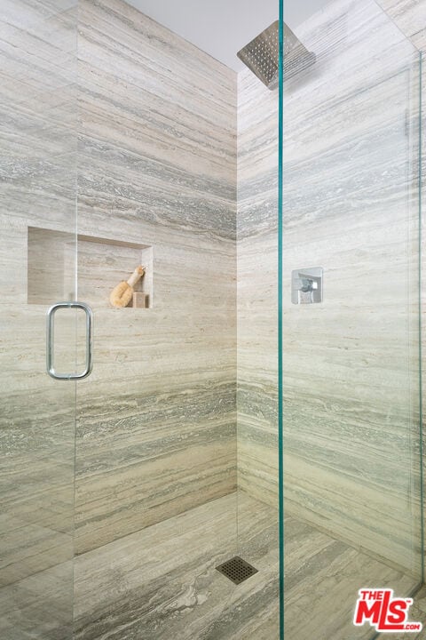 bathroom featuring an enclosed shower