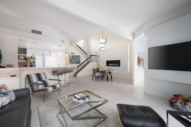 tiled living room with lofted ceiling with beams