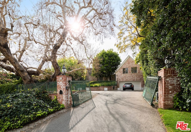 view of gate featuring a garage