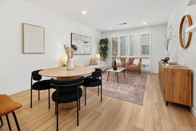 dining room with light hardwood / wood-style flooring