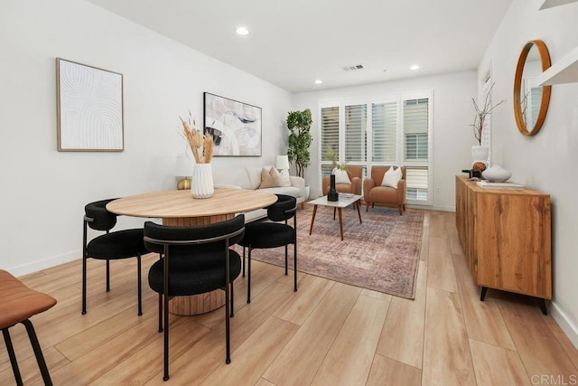 dining room with light wood-type flooring