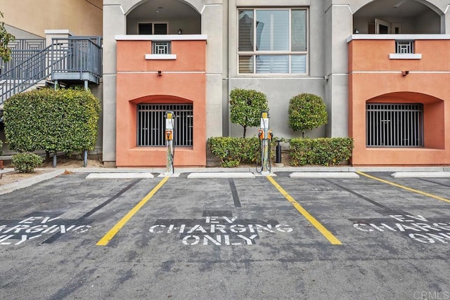 view of property with uncovered parking