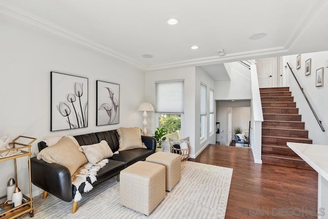 living room with dark wood-type flooring and ornamental molding