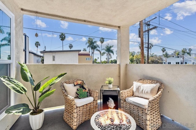 view of patio featuring a balcony