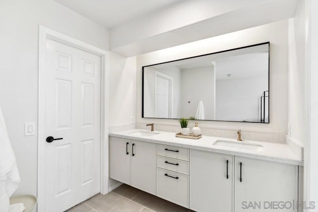 bathroom with vanity and tile patterned flooring