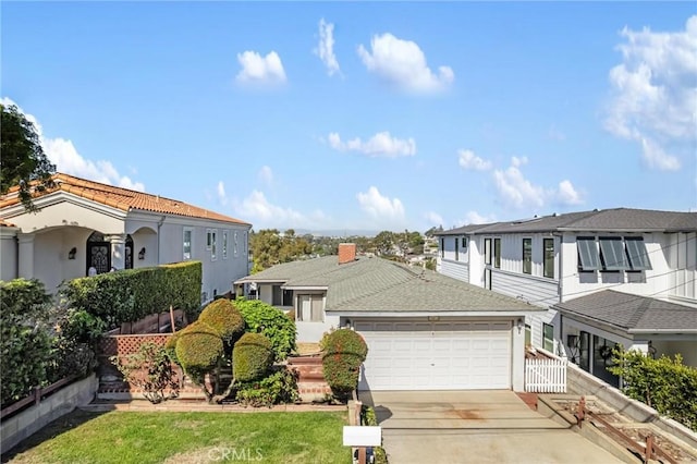 view of front facade featuring a garage and a front lawn