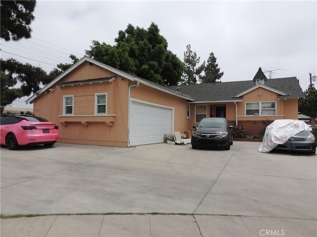 ranch-style house featuring a garage