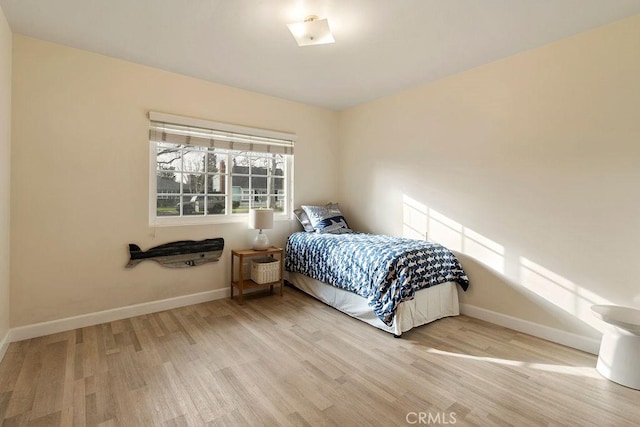 bedroom with hardwood / wood-style floors