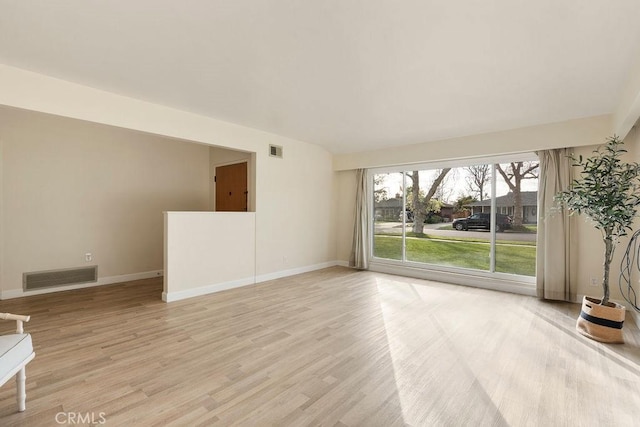 spare room featuring light hardwood / wood-style floors