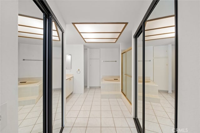 bathroom with vanity, separate shower and tub, and tile patterned flooring