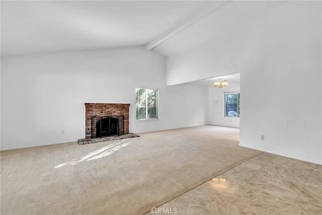 unfurnished living room featuring a brick fireplace, carpet floors, beam ceiling, and plenty of natural light