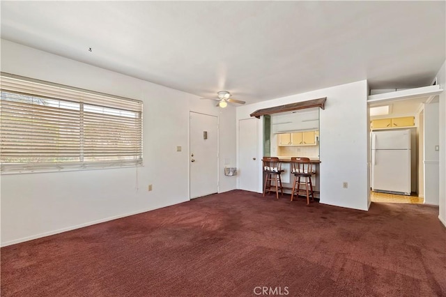 interior space featuring a ceiling fan