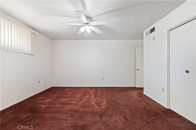 unfurnished bedroom with a closet, baseboards, a ceiling fan, and carpet