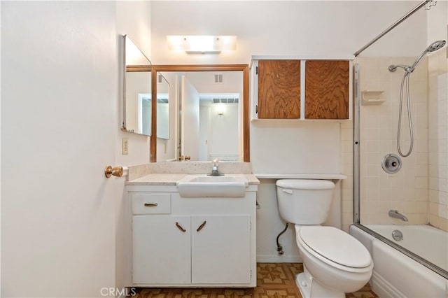 full bathroom featuring washtub / shower combination, visible vents, baseboards, toilet, and vanity