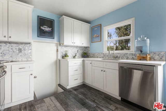 kitchen featuring sink, dishwasher, white cabinets, dark hardwood / wood-style flooring, and decorative backsplash