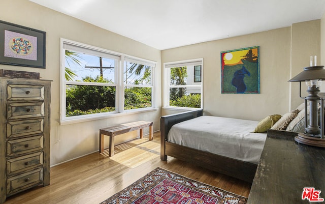 bedroom with light wood-type flooring