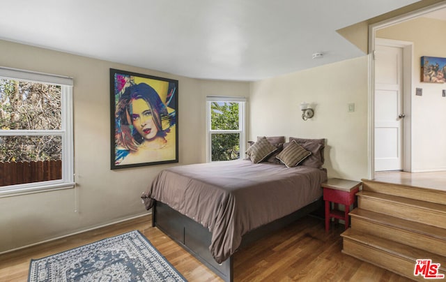 bedroom with wood-type flooring