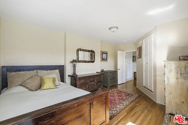 bedroom featuring hardwood / wood-style floors