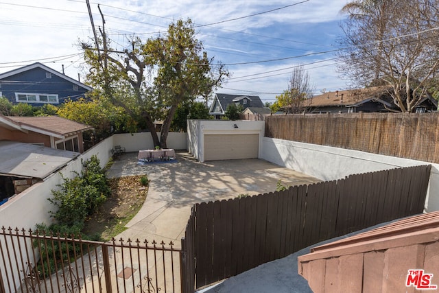 view of yard with a garage