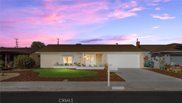 ranch-style house featuring a garage