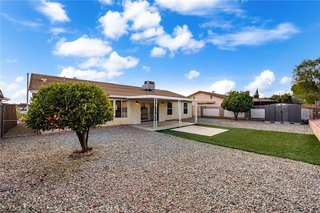 rear view of property featuring a patio area