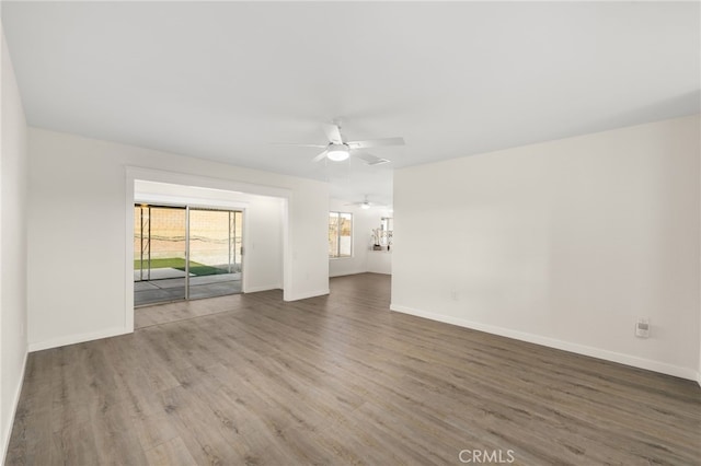 spare room with hardwood / wood-style floors and ceiling fan