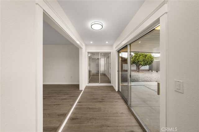 corridor featuring dark hardwood / wood-style flooring