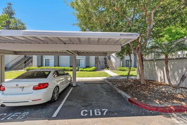 view of vehicle parking featuring a carport