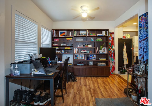 office space with hardwood / wood-style flooring and ceiling fan