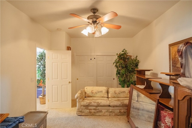 sitting room featuring carpet flooring and ceiling fan