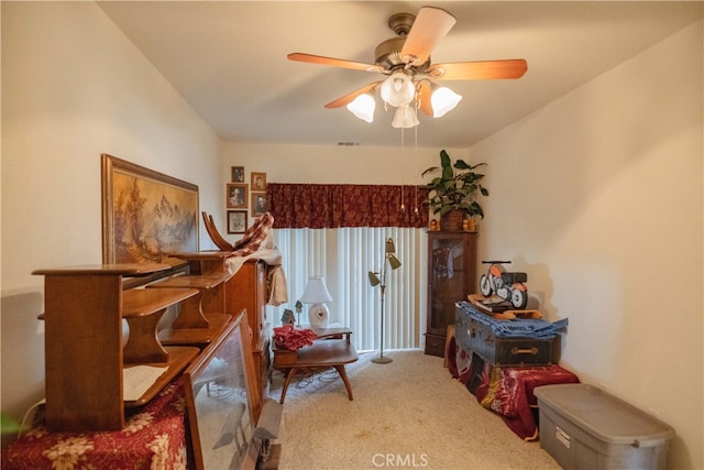 miscellaneous room featuring ceiling fan and carpet