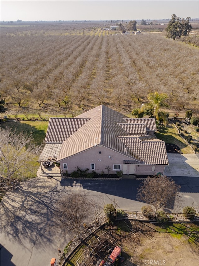 birds eye view of property with a rural view