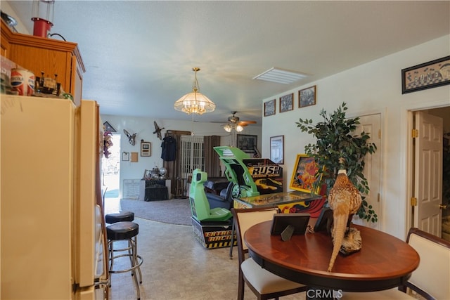 dining space featuring ceiling fan