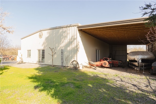 view of outbuilding featuring a lawn