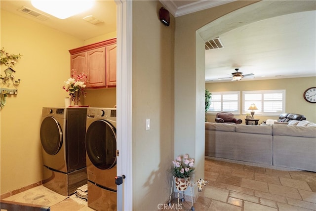 laundry room with crown molding, washer and clothes dryer, cabinets, and ceiling fan