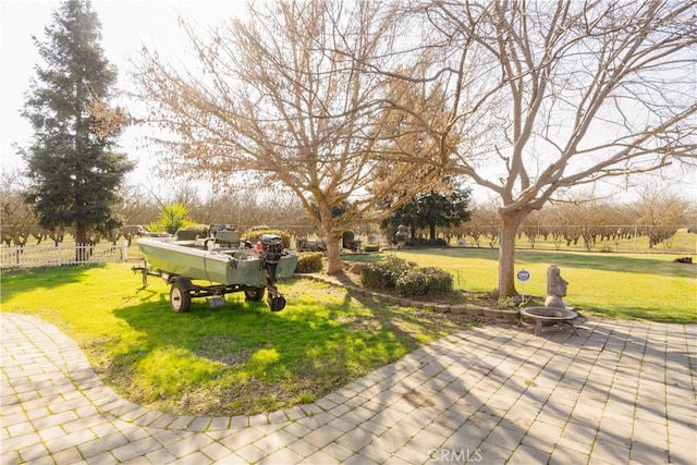 view of home's community with a yard and a patio