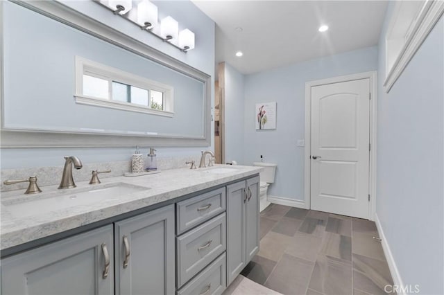 bathroom with vanity and toilet