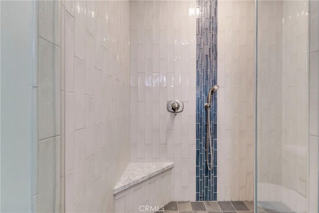 bathroom with tiled shower